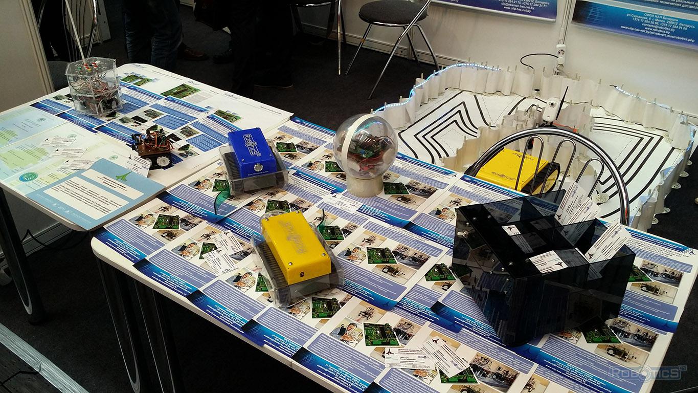 Demonstration of robots in the sector of robotics exhibition stand.