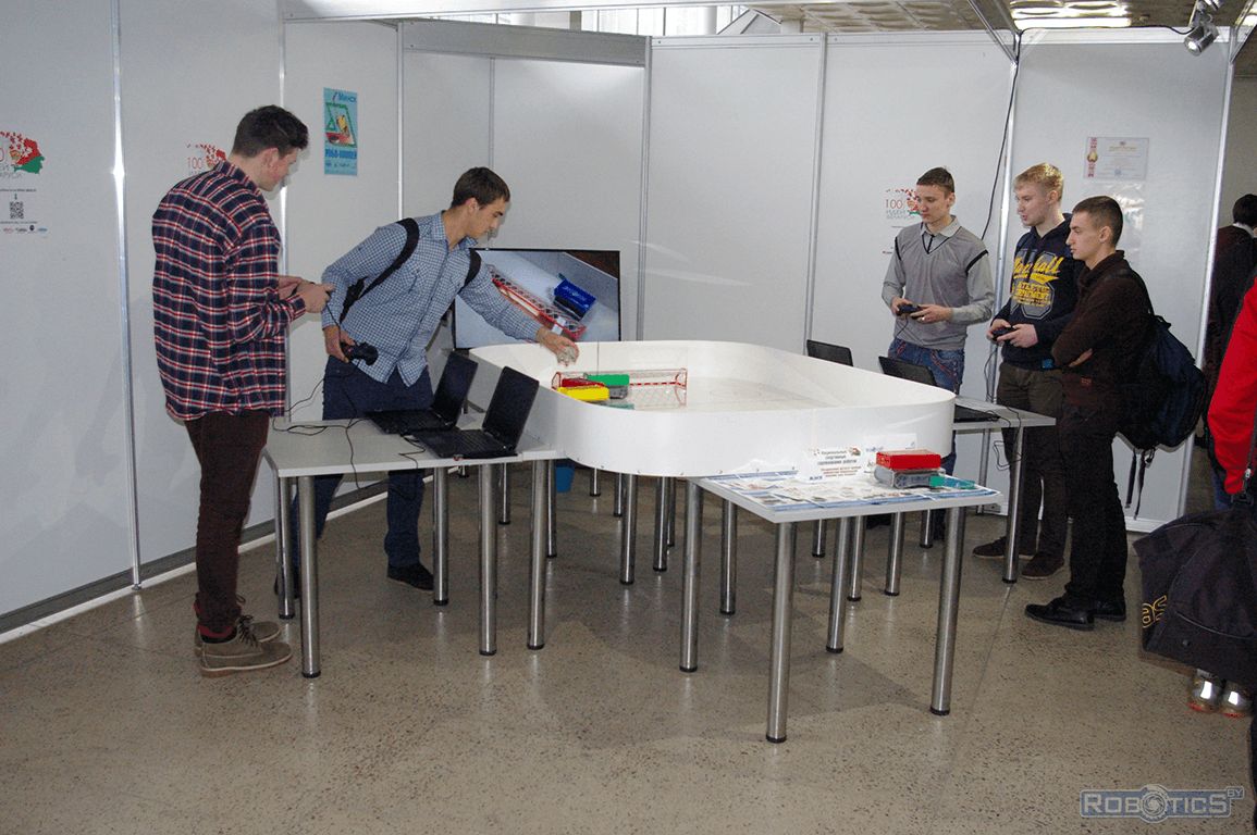 Visitors of the project playing in «Hockey robots».